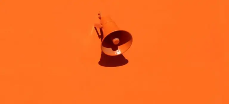 orange megaphone on orange wall