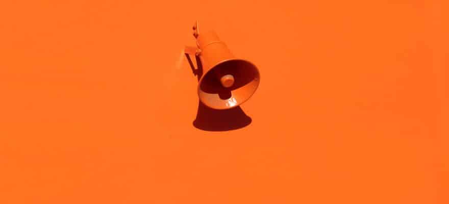 orange megaphone on orange wall