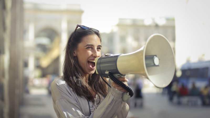 woman speaking on a megaphone