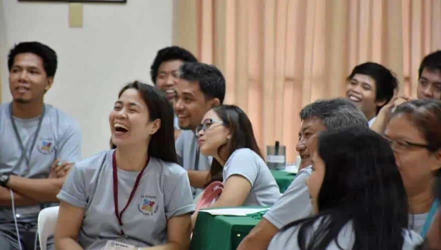 team-building-facilitators-happy-teams team building can engage employees. The experience teach lessons that help build teamwork.