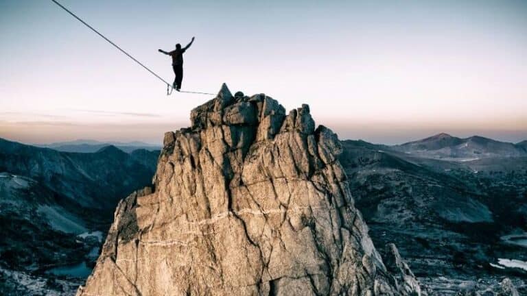 boldness of a man walking on a tightrope