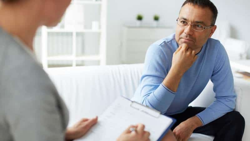 A speaker interviewing a member of the target audience.