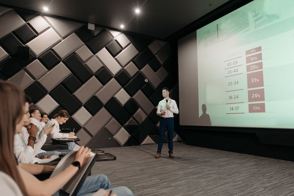 Photo by Pavel Danilyuk Professional business presentation in a modern conference room with attentive audience.